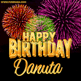 A golden 'Happy Birthday Danuta' message with vibrant fireworks in the background, creating a festive and celebratory vibe in this animated name GIF.