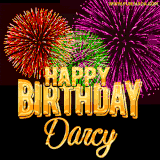 A golden 'Happy Birthday Darcy' message with vibrant fireworks in the background, creating a festive and celebratory vibe in this animated name GIF.