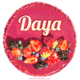 Beautifully decorated red velvet berry birthday cake with vibrant fruits and a glowing 'Daya' name, adding a touch of sweetness and sparkle.