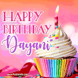 A vibrant birthday GIF featuring a rainbow-colored cupcake topped with white frosting, sprinkles, and a lit candle. The text reads 'Happy Birthday Dayani' in bold pink and violet letters with white outline.