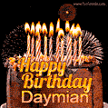 A rich chocolate cake topped with glowing birthday candles and surrounded by bright fireworks. The animated GIF displays the message 'Happy Birthday Daymian' in golden text.