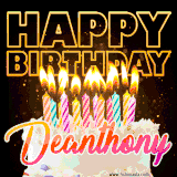 A vibrant animated GIF featuring a delicious birthday cake topped with glowing candles and the name 'Deanthony' in elegant script, and the words 'Happy Birthday' on the black background.