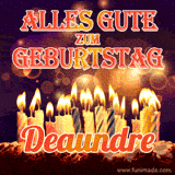 An animated GIF featuring 'Alles Gute Zum Geburtstag Deaundre' in glowing red and gold letters above a cake with colorful lit candles, set against a festive sparkling background.