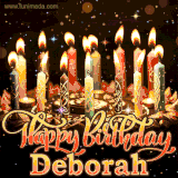 A glowing personalized birthday GIF with name Deborah featuring lit candles with intricate designs, warm lighting, and the text 'Happy Birthday' in an elegant font.
