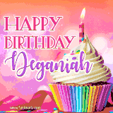 A vibrant birthday GIF featuring a rainbow-colored cupcake topped with white frosting, sprinkles, and a lit candle. The text reads 'Happy Birthday Deganiah' in bold pink and violet letters with white outline.