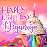 A vibrant birthday GIF featuring a rainbow-colored cupcake topped with white frosting, sprinkles, and a lit candle. The text reads 'Happy Birthday Deganiya' in bold pink and violet letters with white outline.