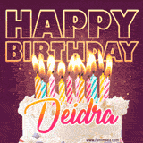 A colorful birthday cake topped with lit candles, with the words 'Happy Birthday Deidra' in bold glowing letters on a burgundy background. Animated flames add a festive touch.
