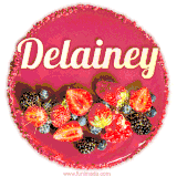 Beautifully decorated red velvet berry birthday cake with vibrant fruits and a glowing 'Delainey' name, adding a touch of sweetness and sparkle.