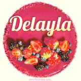 Beautifully decorated red velvet berry birthday cake with vibrant fruits and a glowing 'Delayla' name, adding a touch of sweetness and sparkle.