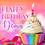 A vibrant birthday GIF featuring a rainbow-colored cupcake topped with white frosting, sprinkles, and a lit candle. The text reads 'Happy Birthday Dema' in bold pink and violet letters with white outline.