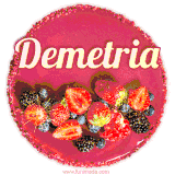 Beautifully decorated red velvet berry birthday cake with vibrant fruits and a glowing 'Demetria' name, adding a touch of sweetness and sparkle.