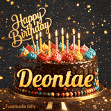 Close-up of a chocolate birthday cake with multicolored frosting swirls and colorful candy beads around the gold base. Greeting text with name Deontae