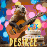Animated birthday GIF showing a capybara playing guitar and singing beside a birthday cake with the name Desiree in large letters and colorful bokeh lights in the background.