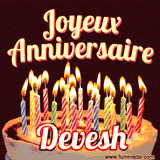 A Happy Birthday GIF in French featuring a festive birthday cake adorned with bright candles and the glowing text 'Joyeux Anniversaire Devesh' in a cheerful style.