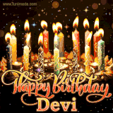 A glowing personalized birthday GIF with name Devi featuring lit candles with intricate designs, warm lighting, and the text 'Happy Birthday' in an elegant font.