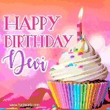 A vibrant birthday GIF featuring a rainbow-colored cupcake topped with white frosting, sprinkles, and a lit candle. The text reads 'Happy Birthday Devi' in bold pink and violet letters with white outline.