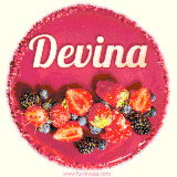 Beautifully decorated red velvet berry birthday cake with vibrant fruits and a glowing 'Devina' name, adding a touch of sweetness and sparkle.