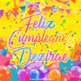 A bright and festive GIF with the text 'Feliz Cumpleaños Dezirae' in Spanish in colorful fonts, surrounded by confetti, balloons, and festive banners on a vibrant yellow background.