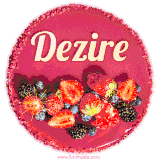 Beautifully decorated red velvet berry birthday cake with vibrant fruits and a glowing 'Dezire' name, adding a touch of sweetness and sparkle.