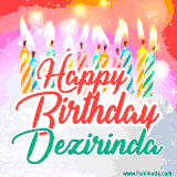 Bright birthday candles with rainbow flames on a cake, alongside the text 'Happy Birthday Dezirinda' in vibrant script in this celebratory animated GIF.