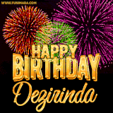 A golden 'Happy Birthday Dezirinda' message with vibrant fireworks in the background, creating a festive and celebratory vibe in this animated name GIF.