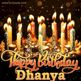 A glowing personalized birthday GIF with name Dhanya featuring lit candles with intricate designs, warm lighting, and the text 'Happy Birthday' in an elegant font.