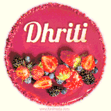 Beautifully decorated red velvet berry birthday cake with vibrant fruits and a glowing 'Dhriti' name, adding a touch of sweetness and sparkle.