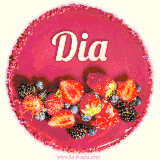 Beautifully decorated red velvet berry birthday cake with vibrant fruits and a glowing 'Dia' name, adding a touch of sweetness and sparkle.