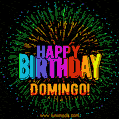A colorful animated GIF featuring the text 'Happy Birthday Domingo!' in rainbow colors with a dynamic iridescent firework display in the background.