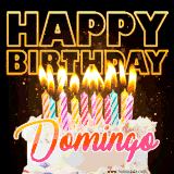 A vibrant animated GIF featuring a delicious birthday cake topped with glowing candles and the name 'Domingo' in elegant script, and the words 'Happy Birthday' on the black background.