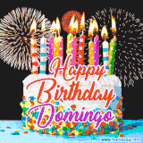 A lively happy birthday animated GIF showcasing a colorful birthday cake covered in sprinkles, topped with glowing candles, and surrounded by vibrant fireworks. The name 'Domingo' is featured in elegant script.