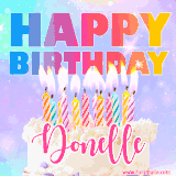A vibrant animated name GIF with the words 'Happy Birthday Donelle' with colorful candles on a creamy cake. The background sparkles with pastel shades, adding a festive touch.