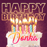 A colorful birthday cake topped with lit candles, with the words 'Happy Birthday Donka' in bold glowing letters on a burgundy background. Animated flames add a festive touch.