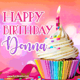 A vibrant birthday GIF featuring a rainbow-colored cupcake topped with white frosting, sprinkles, and a lit candle. The text reads 'Happy Birthday Donna' in bold pink and violet letters with white outline.