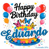 Detailed pink, orange, blue, and yellow butterflies resting on top of a flower-decorated birthday cake for Eduardo.