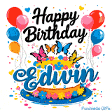 Colorful confetti and hearts floating around a white glazed cake with the name Edwin written on the front.
