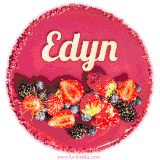Beautifully decorated red velvet berry birthday cake with vibrant fruits and a glowing 'Edyn' name, adding a touch of sweetness and sparkle.