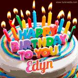 A colorful birthday cake topped with lit candles, with the words 'Happy Birthday Edyn' in bold glowing letters on a burgundy background. Animated flames add a festive touch.