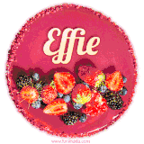 Beautifully decorated red velvet berry birthday cake with vibrant fruits and a glowing 'Effie' name, adding a touch of sweetness and sparkle.