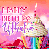 A vibrant birthday GIF featuring a rainbow-colored cupcake topped with white frosting, sprinkles, and a lit candle. The text reads 'Happy Birthday Efthalia' in bold pink and violet letters with white outline.
