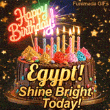Glowing pink neon light topper saying Happy Birthday on a chocolate cake with the name Egypt! on the front.