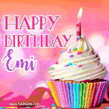 A vibrant birthday GIF featuring a rainbow-colored cupcake topped with white frosting, sprinkles, and a lit candle. The text reads 'Happy Birthday Emi' in bold pink and violet letters with white outline.