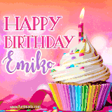 A vibrant birthday GIF featuring a rainbow-colored cupcake topped with white frosting, sprinkles, and a lit candle. The text reads 'Happy Birthday Emiko' in bold pink and violet letters with white outline.