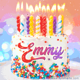 A cheerful white birthday cake with multicolor sprinkles, lit candles, and 'Emmy' written in vibrant letters, in an animated GIF.