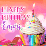 A vibrant birthday GIF featuring a rainbow-colored cupcake topped with white frosting, sprinkles, and a lit candle. The text reads 'Happy Birthday Emori' in bold pink and violet letters with white outline.