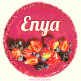 Beautifully decorated red velvet berry birthday cake with vibrant fruits and a glowing 'Enya' name, adding a touch of sweetness and sparkle.