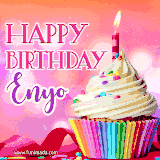 A vibrant birthday GIF featuring a rainbow-colored cupcake topped with white frosting, sprinkles, and a lit candle. The text reads 'Happy Birthday Enyo' in bold pink and violet letters with white outline.