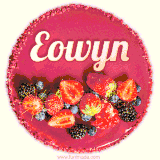 Beautifully decorated red velvet berry birthday cake with vibrant fruits and a glowing 'Eowyn' name, adding a touch of sweetness and sparkle.