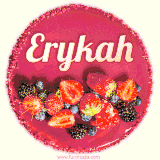 Beautifully decorated red velvet berry birthday cake with vibrant fruits and a glowing 'Erykah' name, adding a touch of sweetness and sparkle.