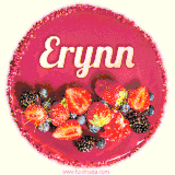 Beautifully decorated red velvet berry birthday cake with vibrant fruits and a glowing 'Erynn' name, adding a touch of sweetness and sparkle.
